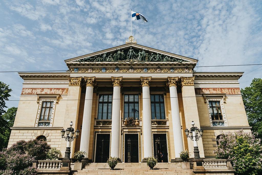 Young travelers socializing in a cozy hostel common area
